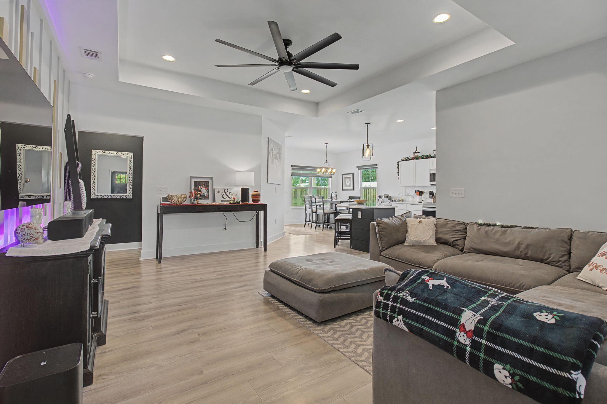 197 West 1st Avenue Crestview, FL 32536 - Photo 5 of 32 a living room with furniture and wooden floor