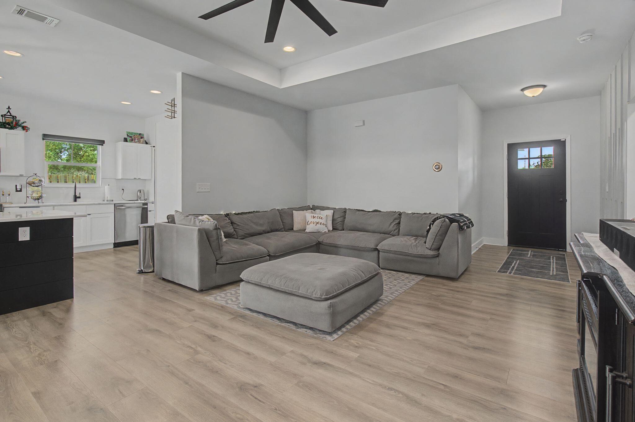 197 West 1st Avenue Crestview, FL 32536 - Photo 6 of 32 a living room with furniture and a wooden floor