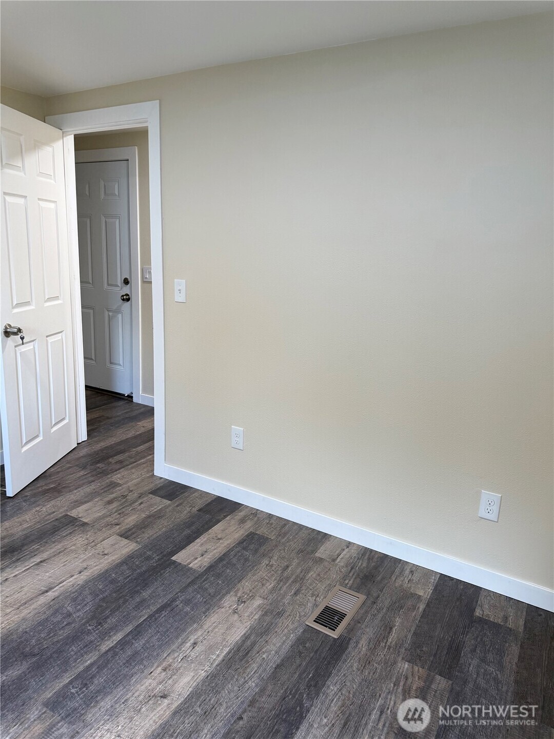 2610 Calawah Way, Unit 33 Forks, WA 98331 - Photo 12 of 14 a view of an empty room and wooden floor