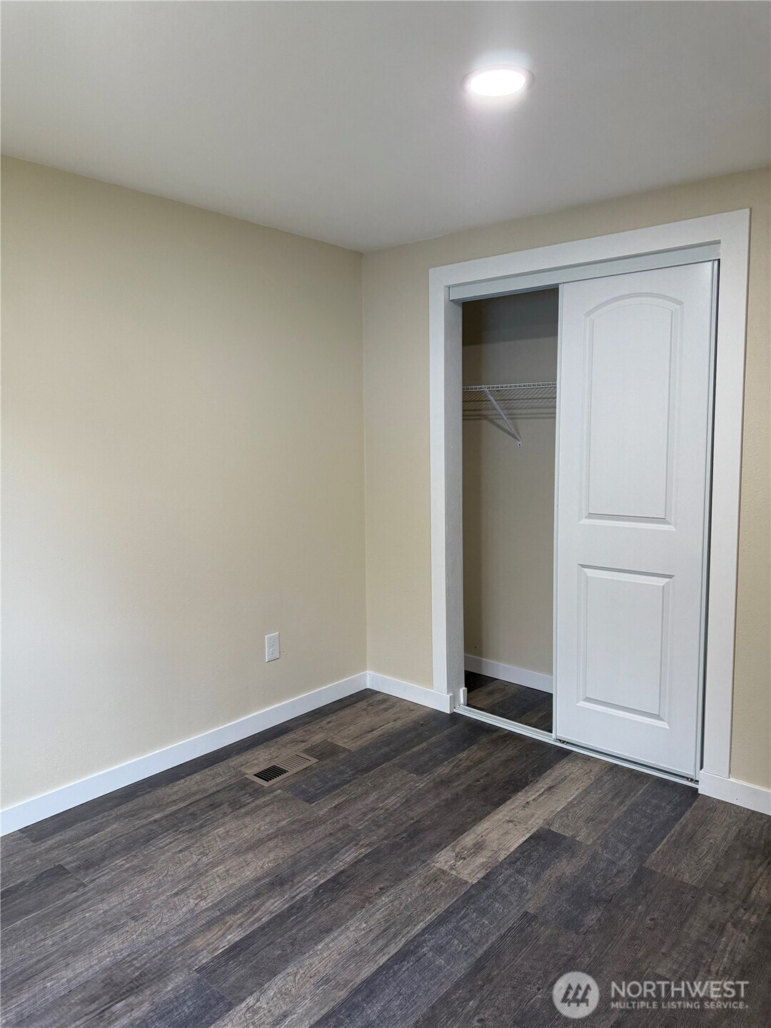 2610 Calawah Way, Unit 33 Forks, WA 98331 - Photo 4 of 14 a view of an empty room with wooden floor