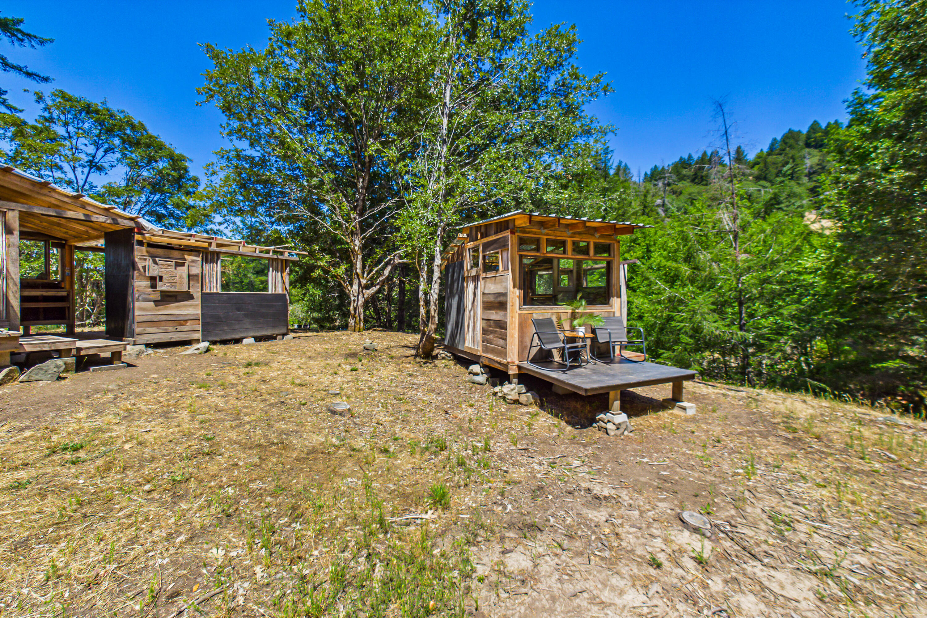 60890 Bell Springs Road Laytonville, CA 95454 - Photo 28 of 77 a view of a backyard with large trees and plants