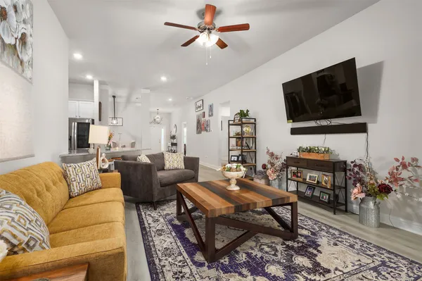 a living room with furniture and a flat screen tv