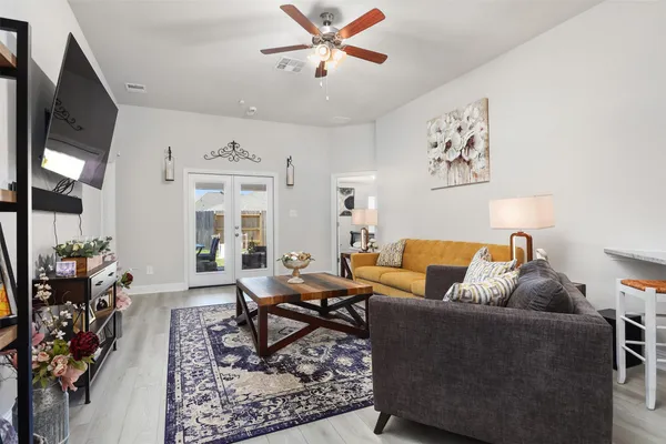 a living room with furniture and a rug