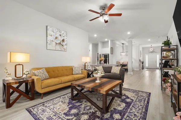 a living room with furniture and a rug