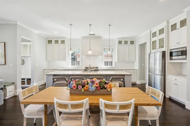 a kitchen with a table and chairs in it