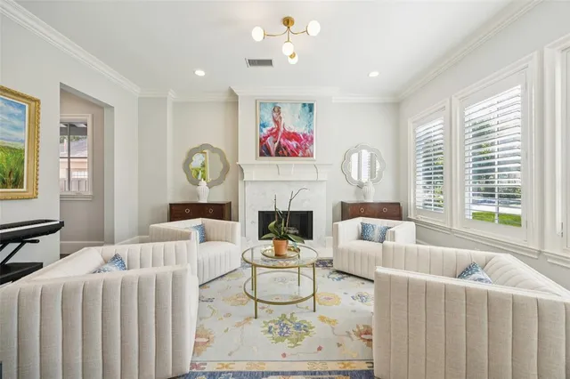 a living room with furniture fireplace and window