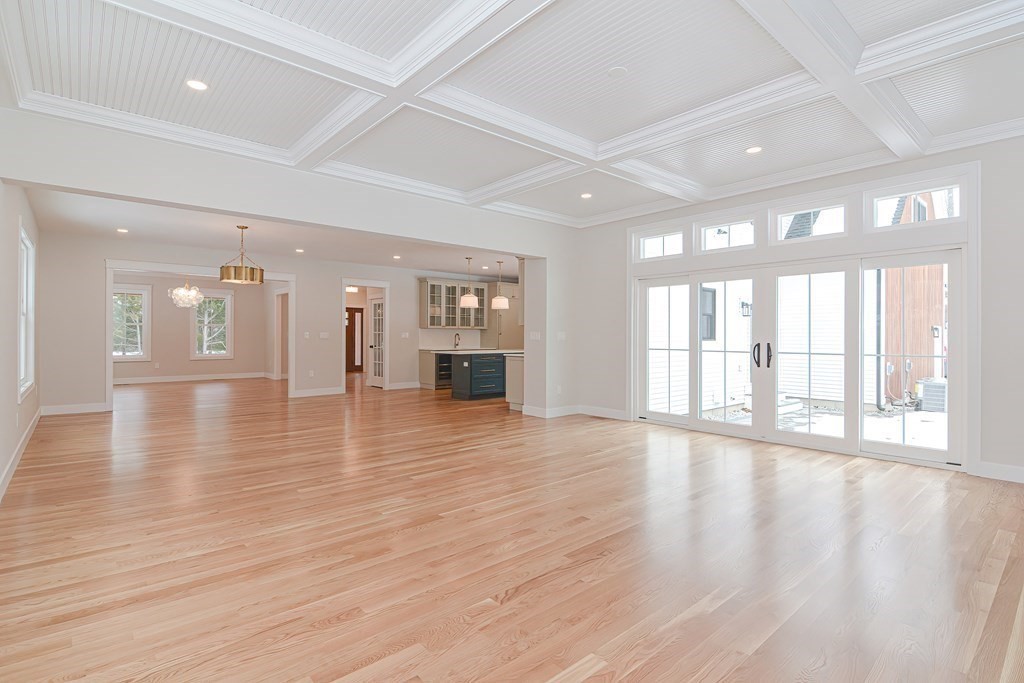 Lot 7 Maple Avenue Groton, MA 01450 - Photo 12 of 42 a view of an empty room with wooden floor and a large window