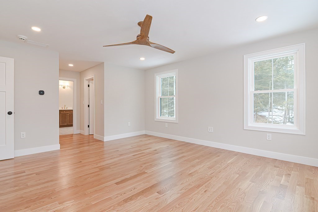 Lot 7 Maple Avenue Groton, MA 01450 - Photo 19 of 42 a view of an empty room with wooden floor and a window