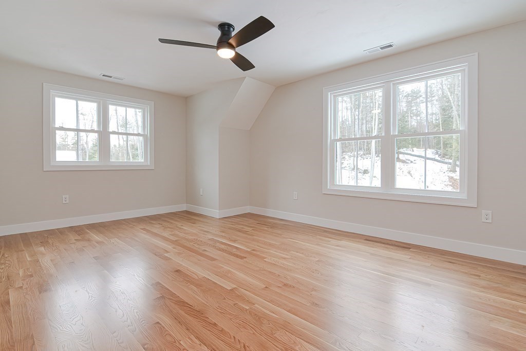 Lot 7 Maple Avenue Groton, MA 01450 - Photo 24 of 42 a view of an empty room with wooden floor and a window