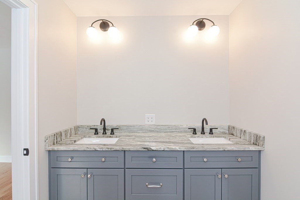 Lot 7 Maple Avenue Groton, MA 01450 - Photo 25 of 42 a bathroom with a granite countertop sink and a mirror