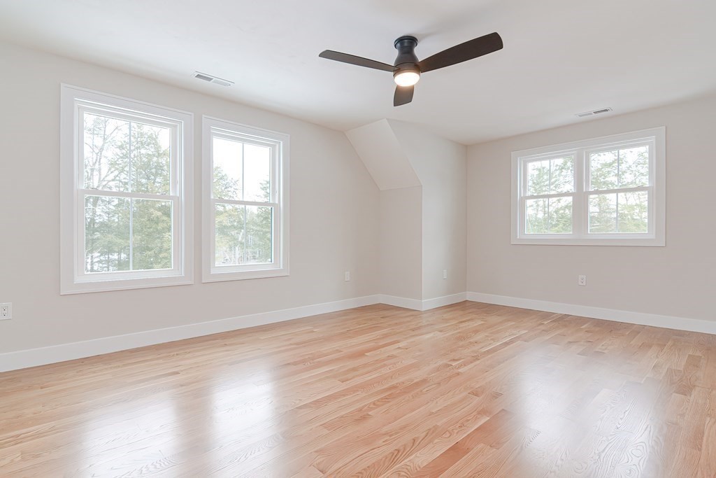 Lot 7 Maple Avenue Groton, MA 01450 - Photo 27 of 42 a view of an empty room with wooden floor and a window