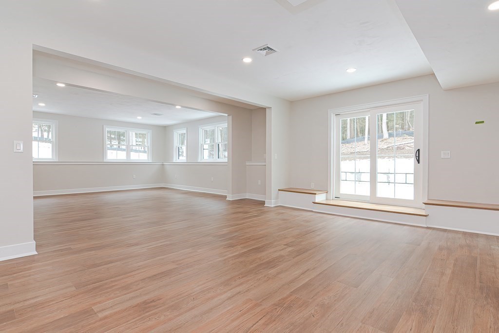 Lot 7 Maple Avenue Groton, MA 01450 - Photo 34 of 42 an empty room with wooden floor and windows