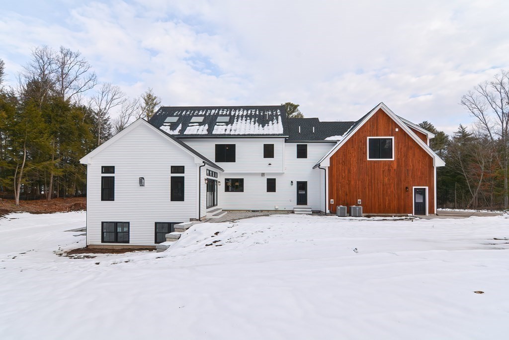 Lot 7 Maple Avenue Groton, MA 01450 - Photo 36 of 42 a view of a white house with a yard