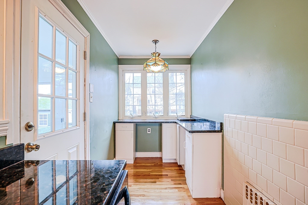 9 Russ Street Methuen, MA 01844 - Photo 11 of 37 a hallway with a window and chandelier