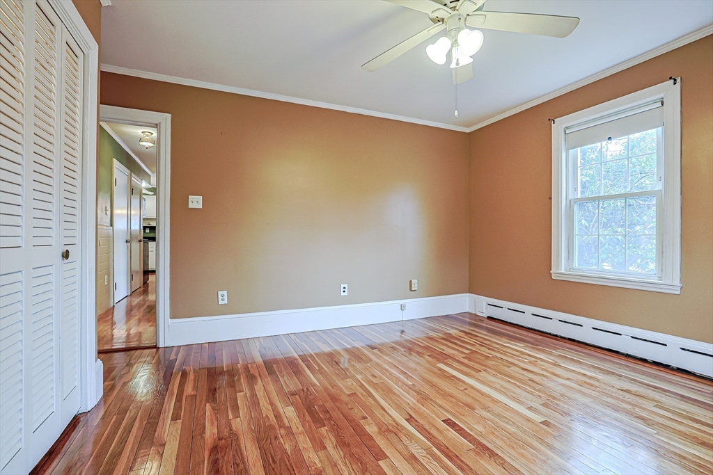 9 Russ Street Methuen, MA 01844 - Photo 15 of 37 a view of an empty room with wooden floor and a window