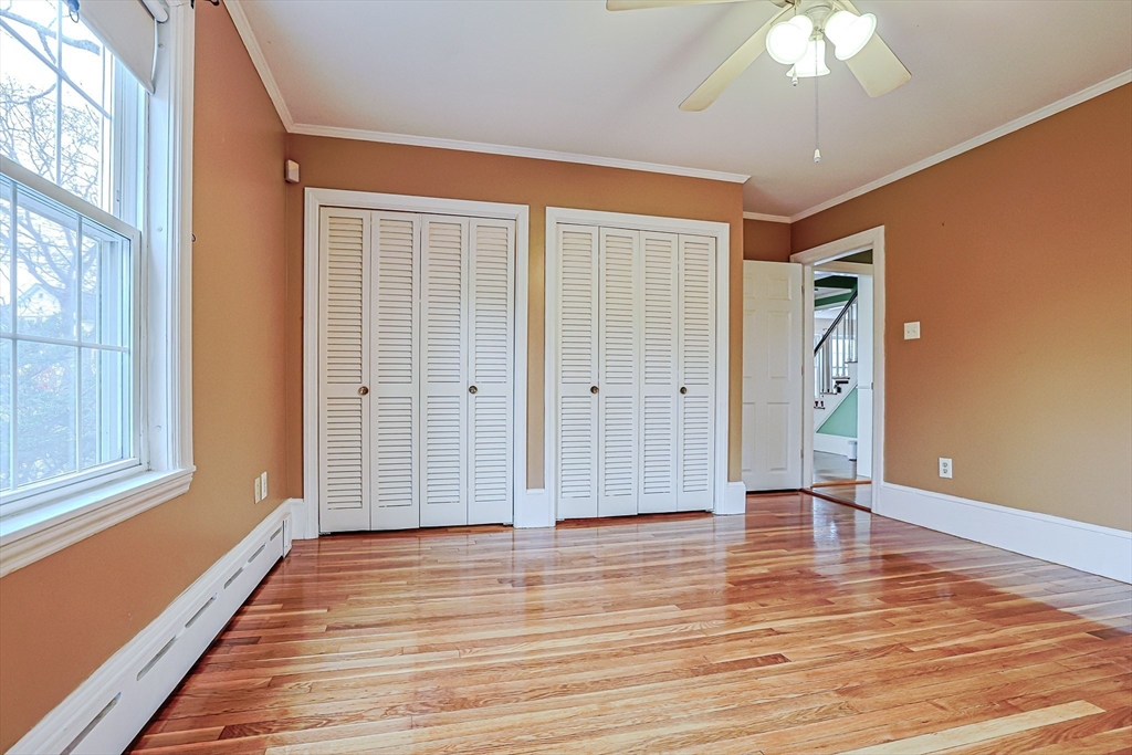 9 Russ Street Methuen, MA 01844 - Photo 16 of 37 a view of an empty room with wooden floor and a window