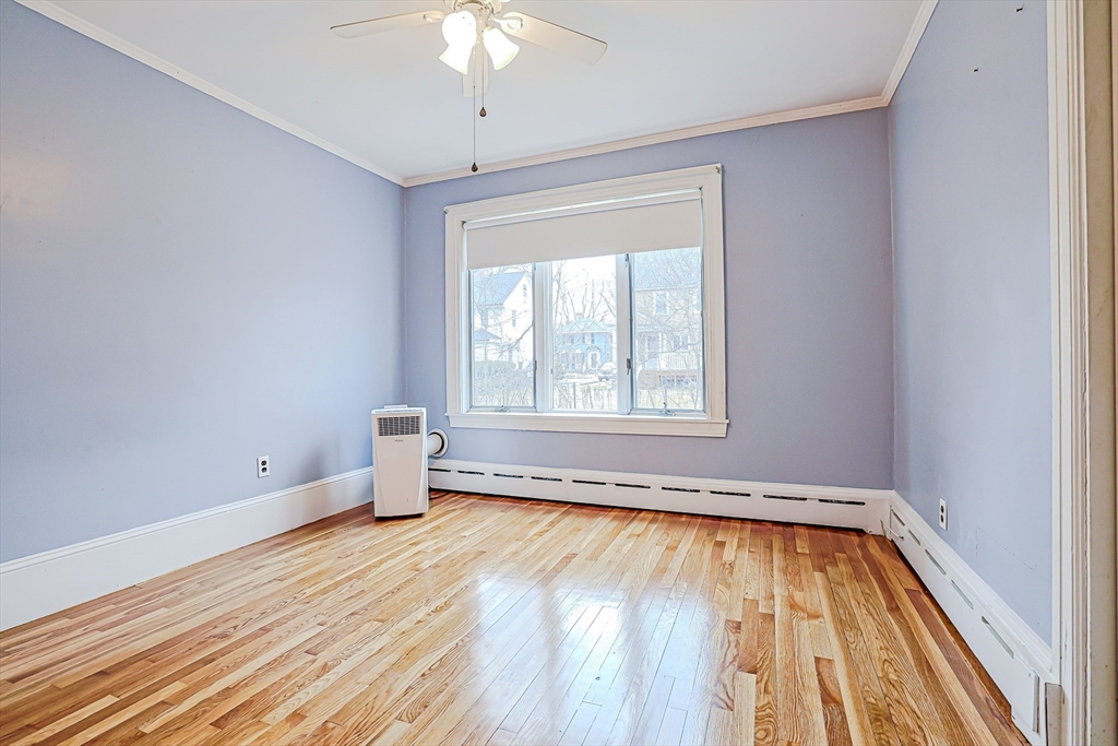 9 Russ Street Methuen, MA 01844 - Photo 17 of 37 wooden floor in an empty room with a window