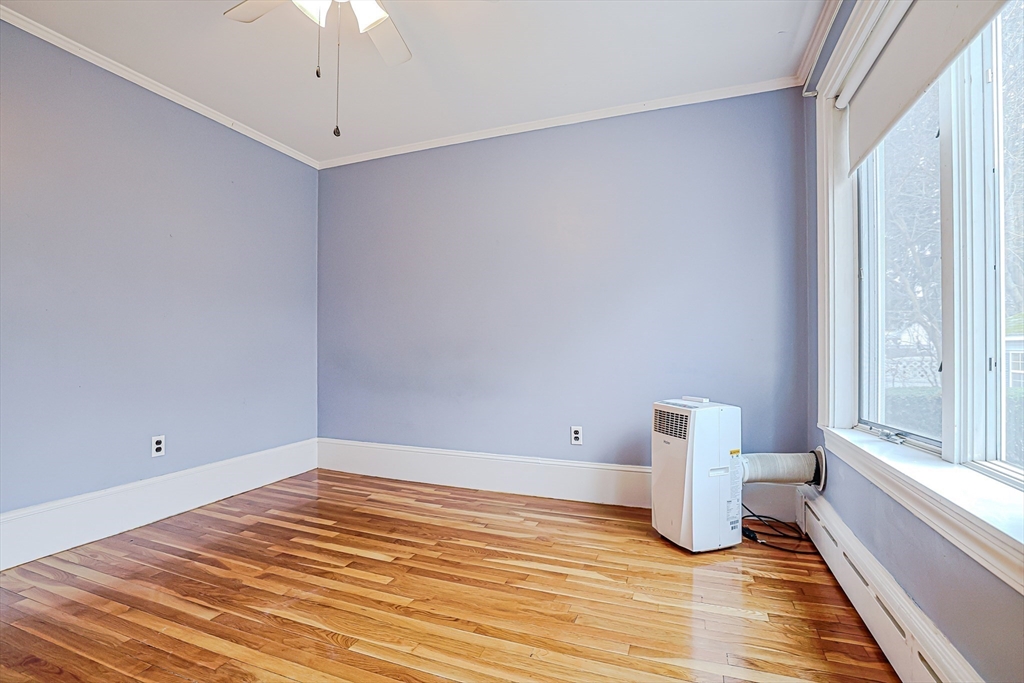 9 Russ Street Methuen, MA 01844 - Photo 18 of 37 a view of empty room with wooden floor and fan