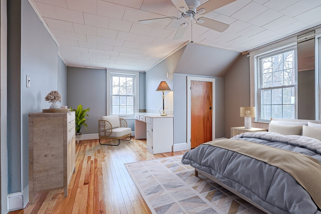 9 Russ Street Methuen, MA 01844 - Photo 19 of 37 a bedroom with a bed and wooden floor