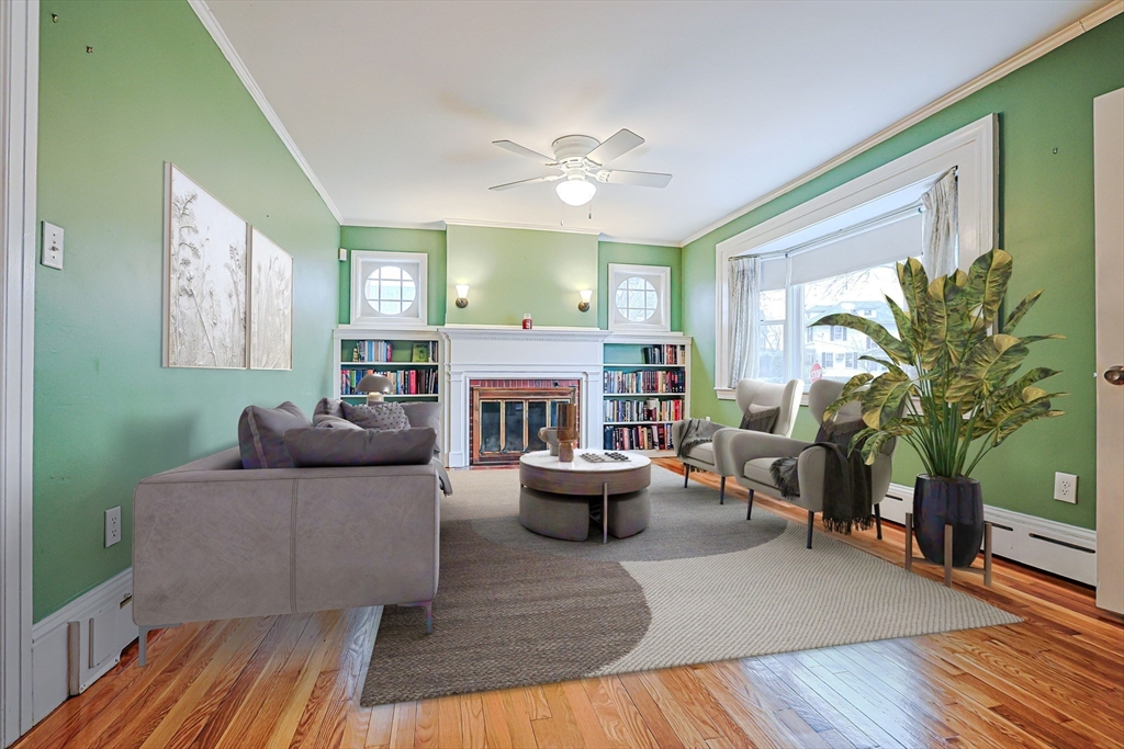 9 Russ Street Methuen, MA 01844 - Photo 2 of 37 a living room with furniture and a fireplace