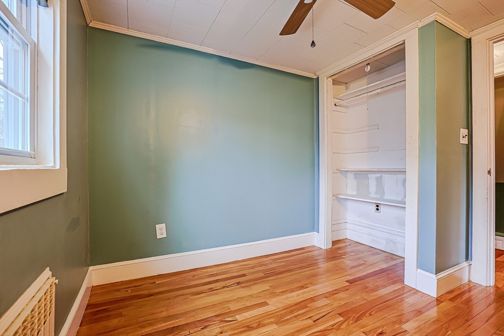 9 Russ Street Methuen, MA 01844 - Photo 22 of 37 a view of an empty room with wooden floor and a window