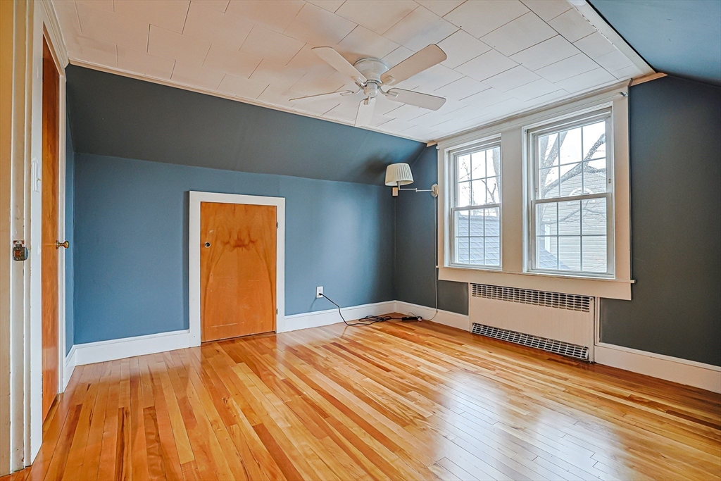 9 Russ Street Methuen, MA 01844 - Photo 25 of 37 a view of an empty room with wooden floor and a window