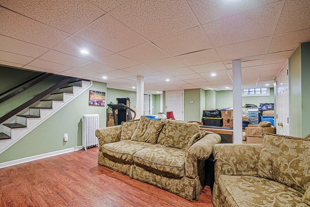 9 Russ Street Methuen, MA 01844 - Photo 27 of 37 a living room with furniture and a wooden floor