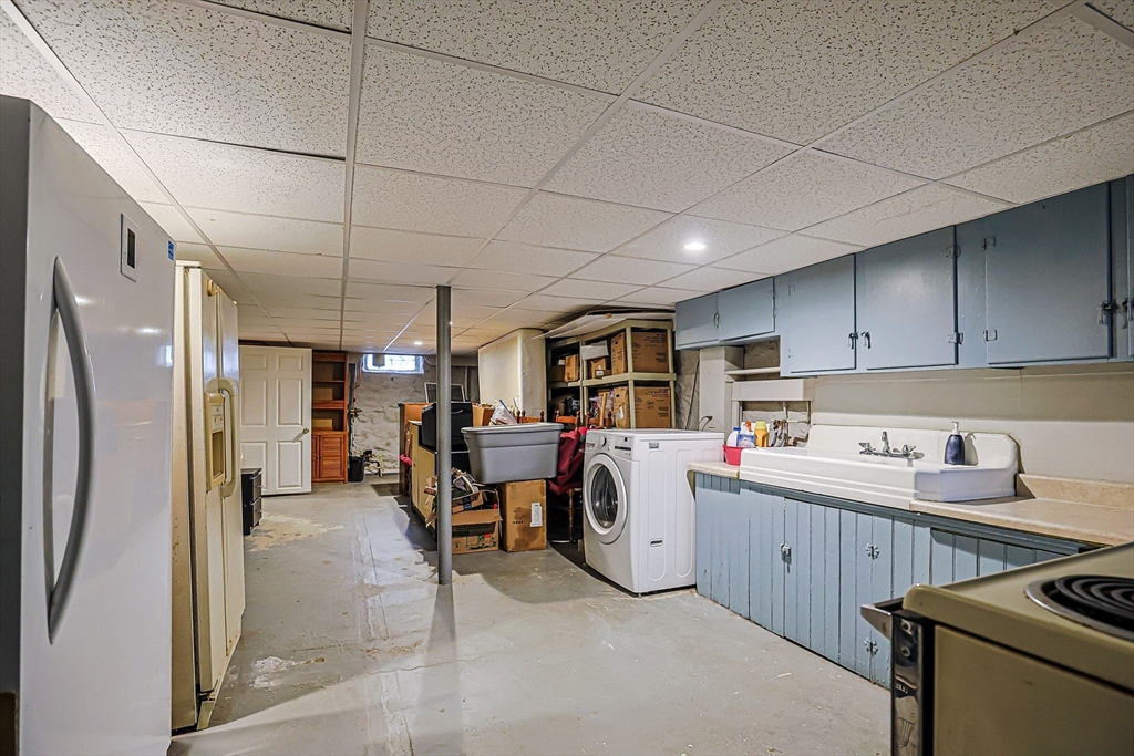 9 Russ Street Methuen, MA 01844 - Photo 30 of 37 a kitchen that has a lot of cabinets a sink and appliances