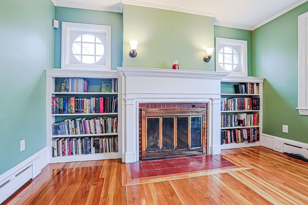 9 Russ Street Methuen, MA 01844 - Photo 5 of 37 a living room with fireplace furniture and a book shelf