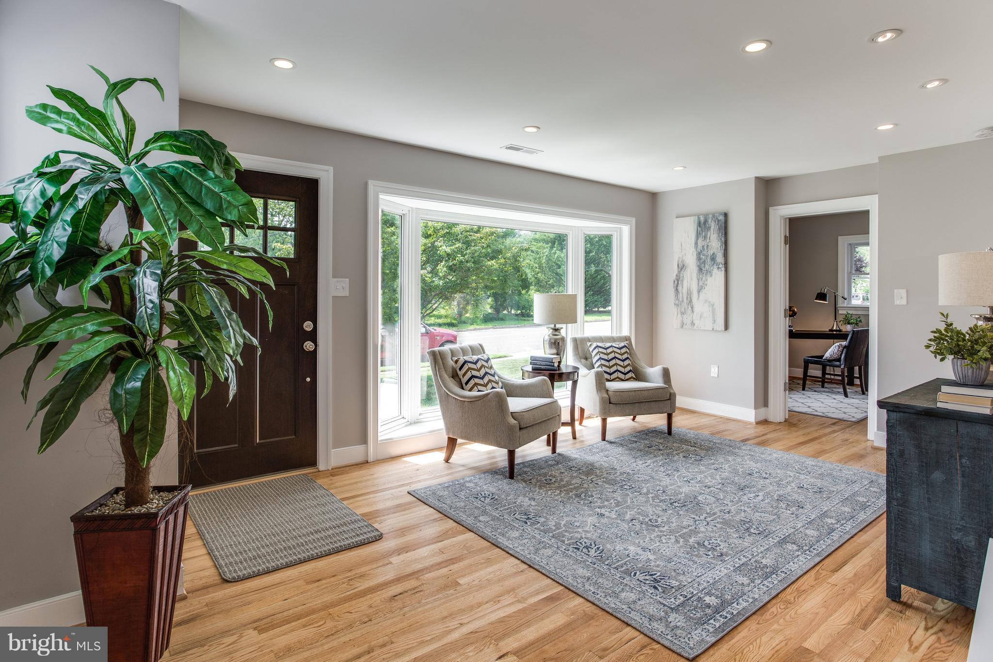 7017 Quander Road Alexandria, VA 22307 - Photo 2 of 30 a living room with furniture and a potted plant