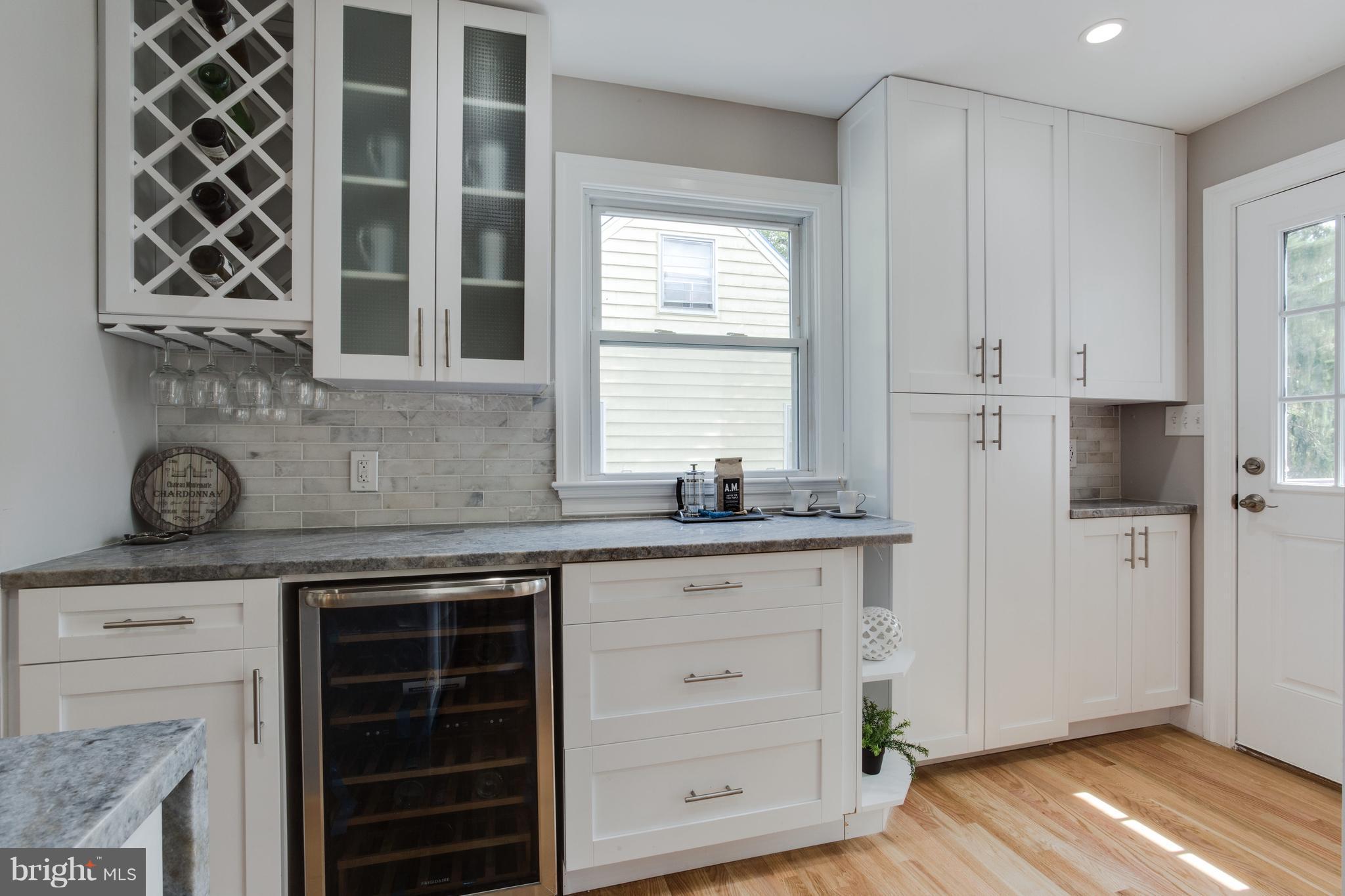7017 Quander Road Alexandria, VA 22307 - Photo 11 of 30 a kitchen with stainless steel appliances granite countertop a stove and a refrigerator