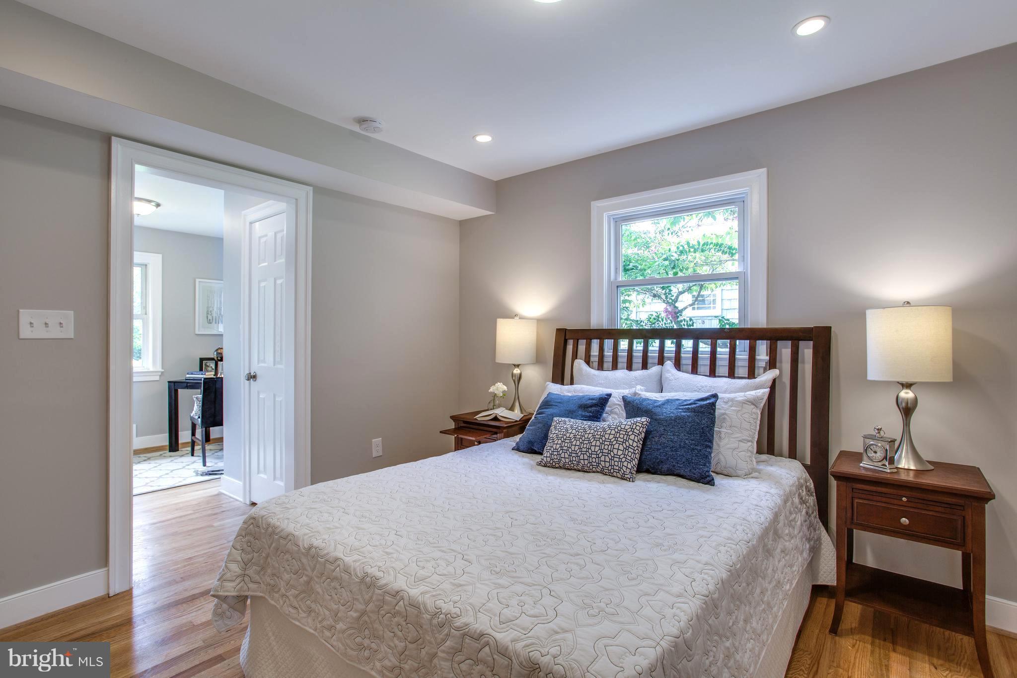7017 Quander Road Alexandria, VA 22307 - Photo 12 of 30 a bedroom with bed and a night stand