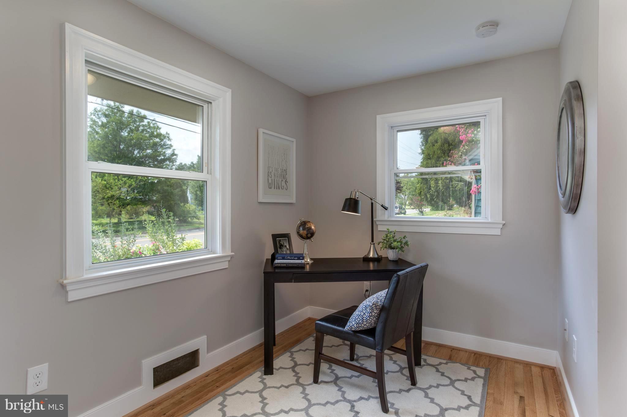 7017 Quander Road Alexandria, VA 22307 - Photo 15 of 30 a dining room with a window and a table