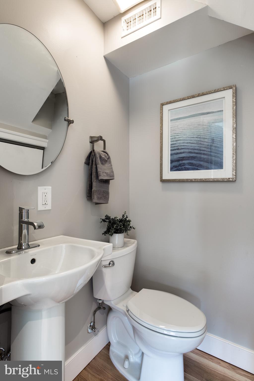 7017 Quander Road Alexandria, VA 22307 - Photo 19 of 30 a bathroom with a sink mirror and toilet