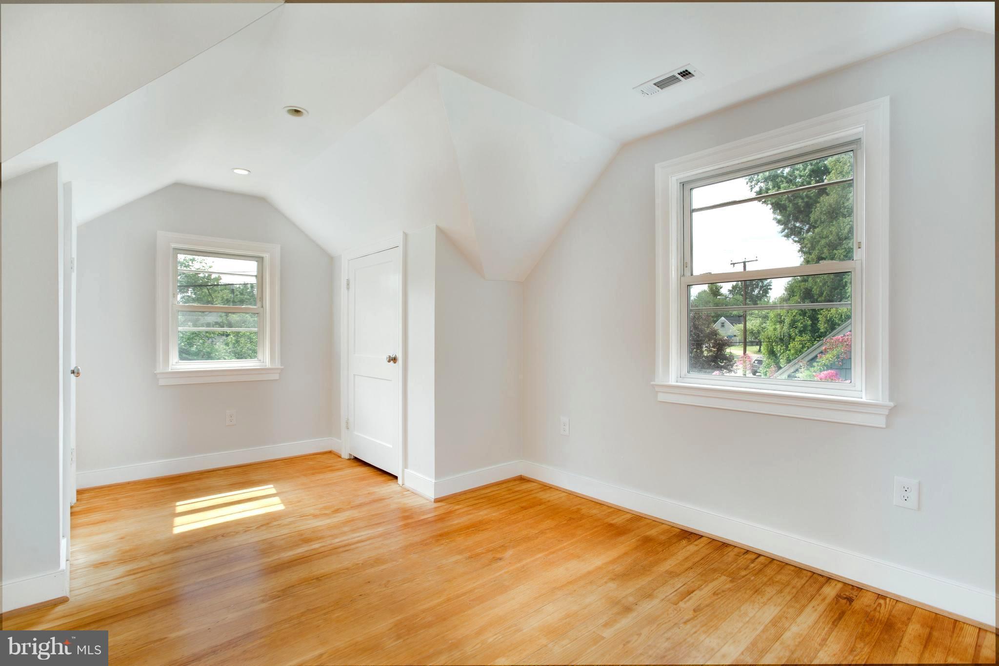 7017 Quander Road Alexandria, VA 22307 - Photo 23 of 30 a view of empty room with wooden floor and fan