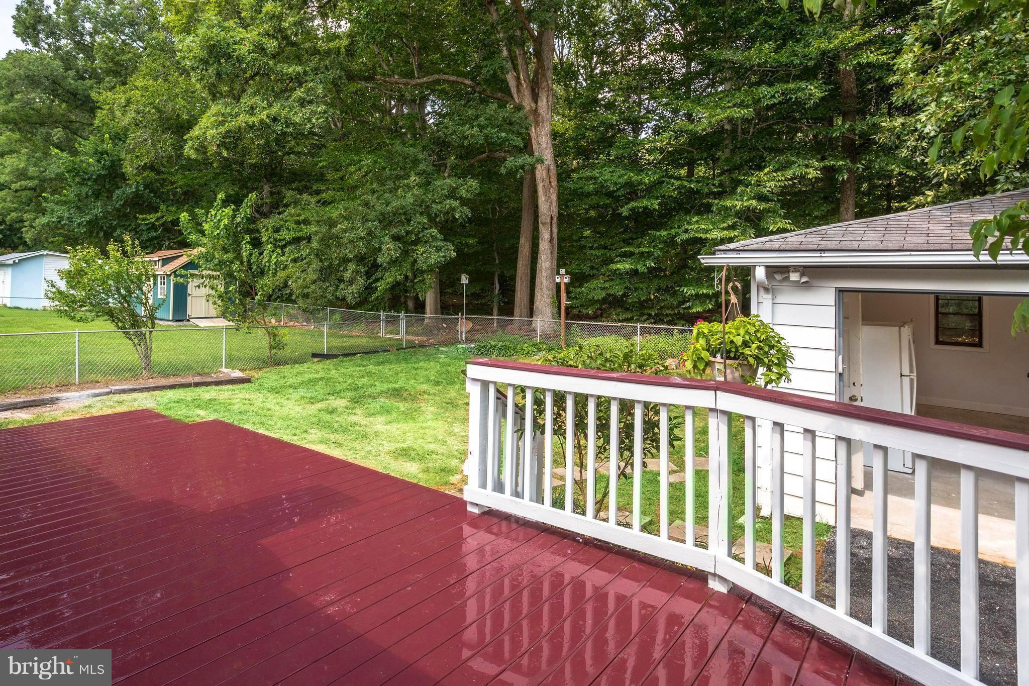 7017 Quander Road Alexandria, VA 22307 - Photo 27 of 30 a view of a deck with a yard