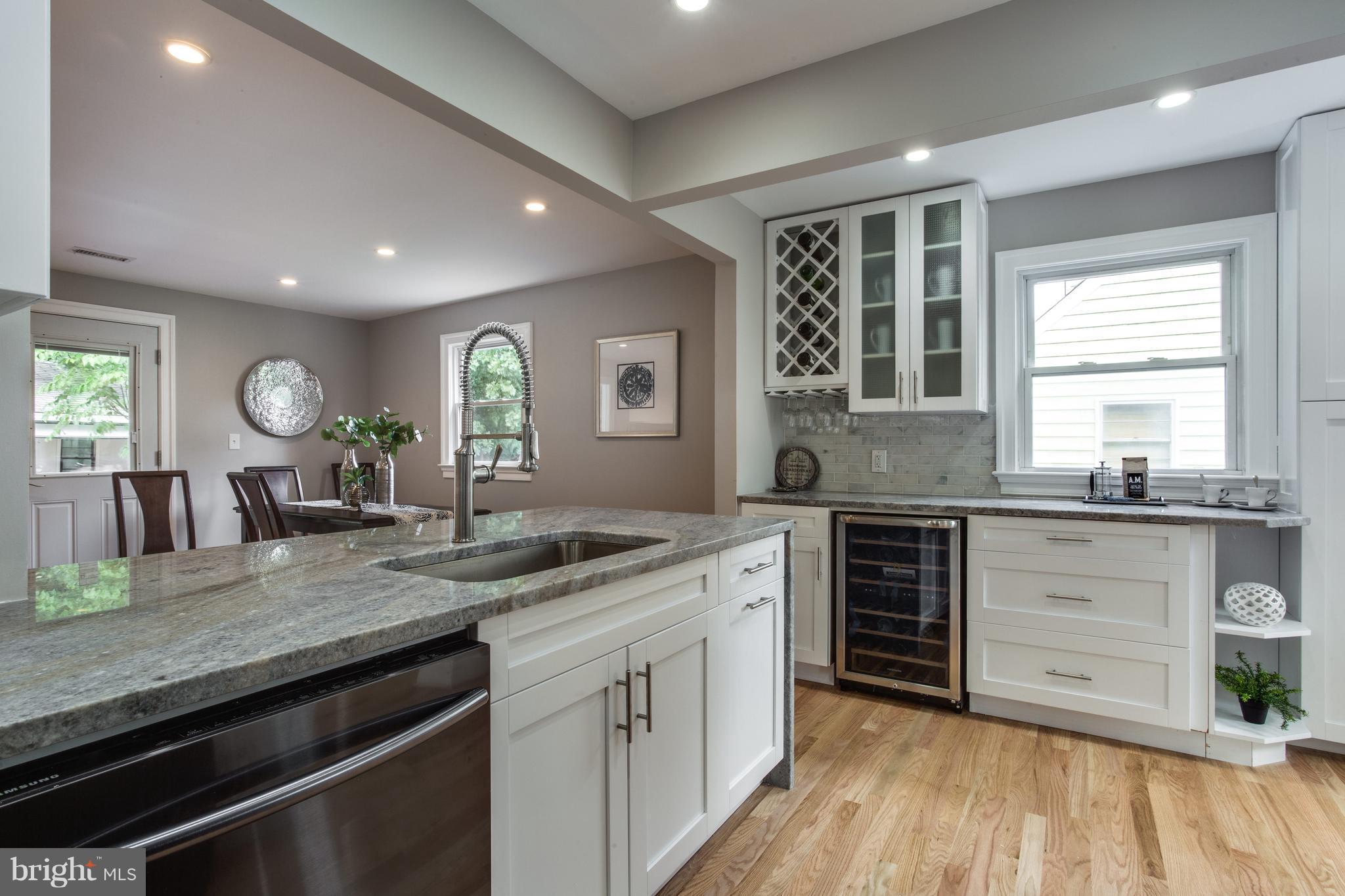 7017 Quander Road Alexandria, VA 22307 - Photo 5 of 30 a kitchen with granite countertop stainless steel appliances stove sink and cabinets