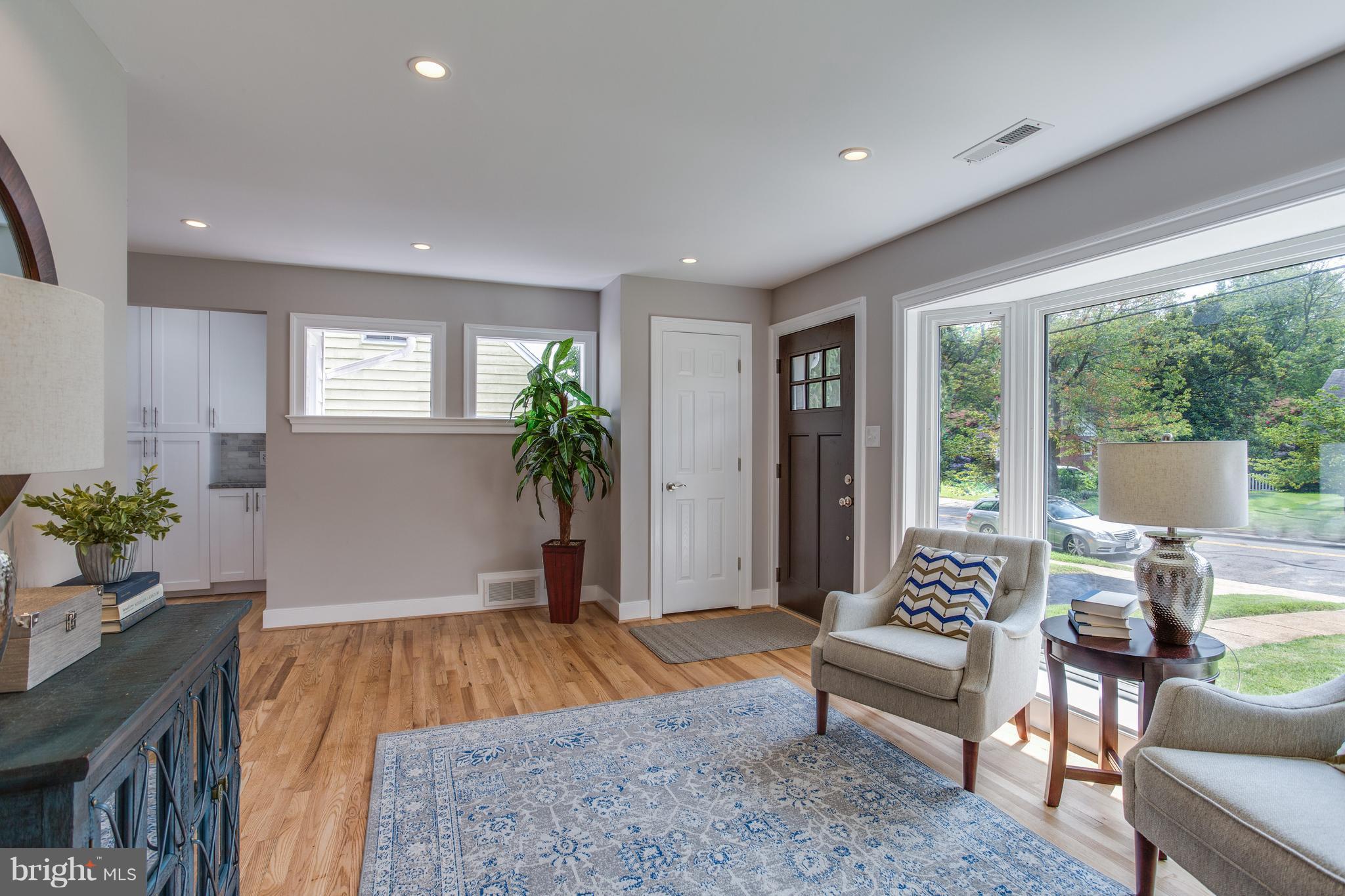 7017 Quander Road Alexandria, VA 22307 - Photo 9 of 30 a living room with furniture and a potted plant