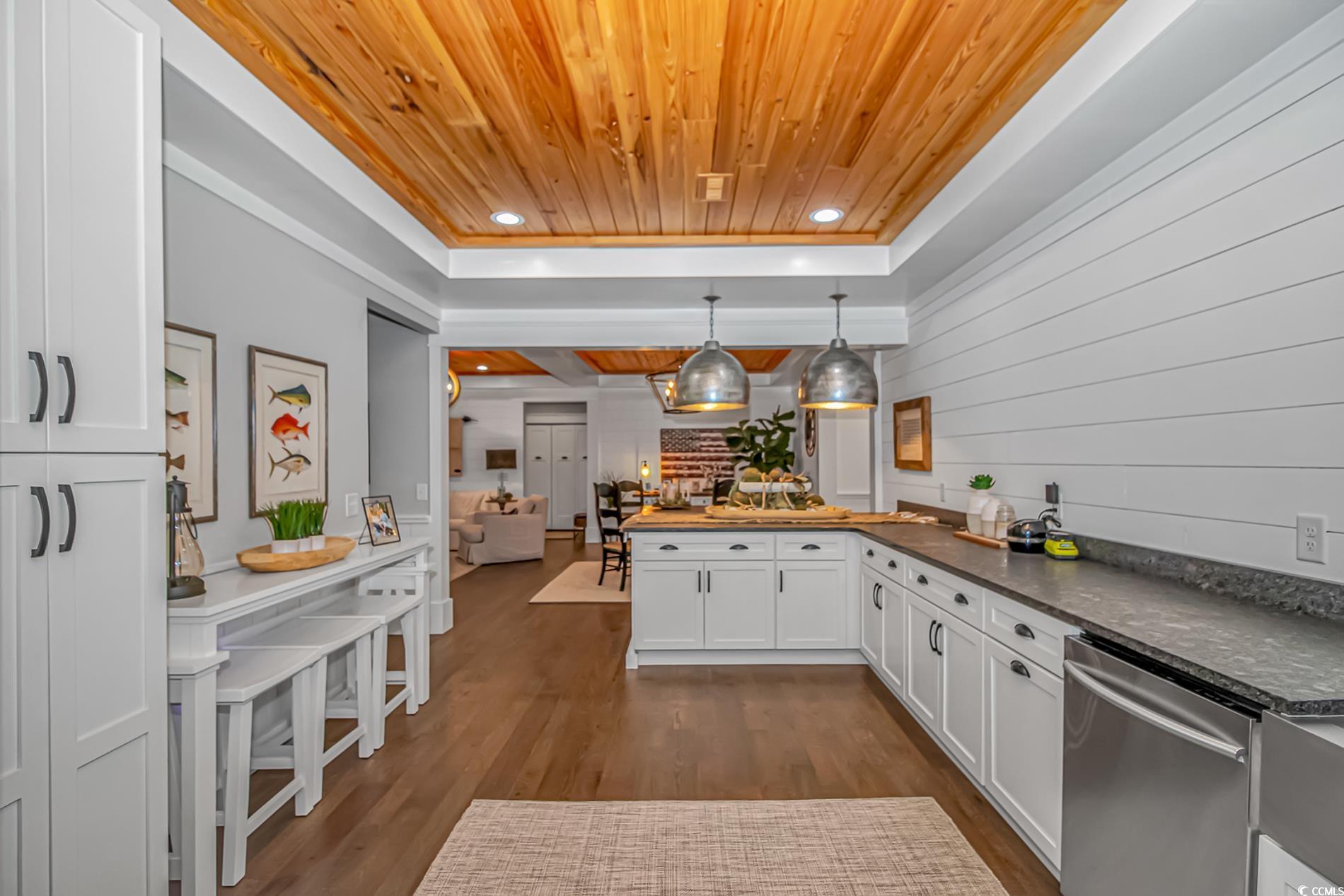 15810 County Line Road Andrews, SC 29510 - Photo 15 of 35 Kitchen featuring wooden ceiling, dishwasher, a peninsula, white cabinetry, and dark wood-style flooring