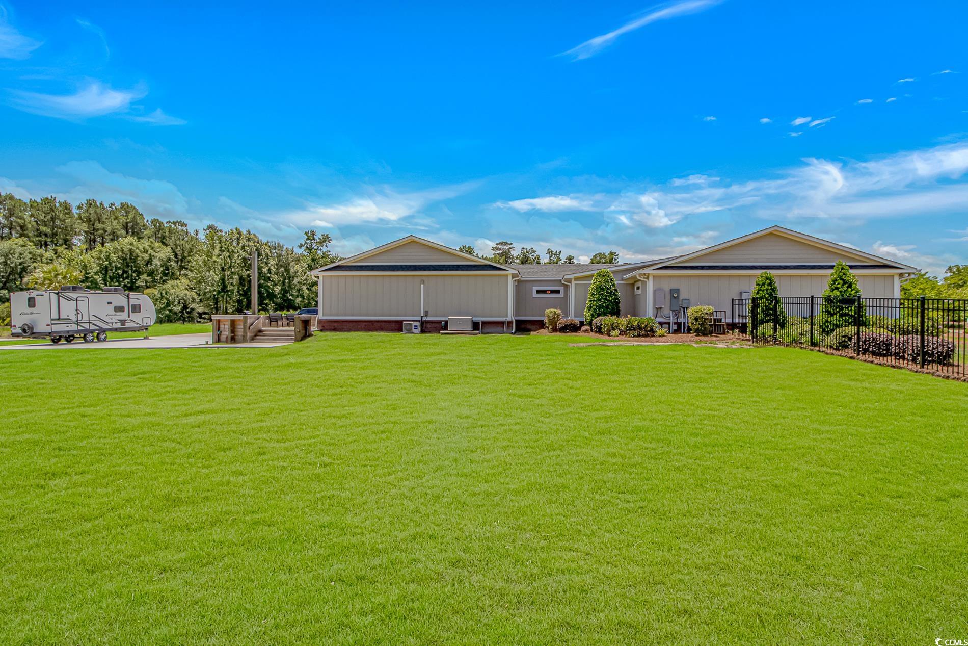 15810 County Line Road Andrews, SC 29510 - Photo 7 of 35 Rear view of property featuring board and batten siding