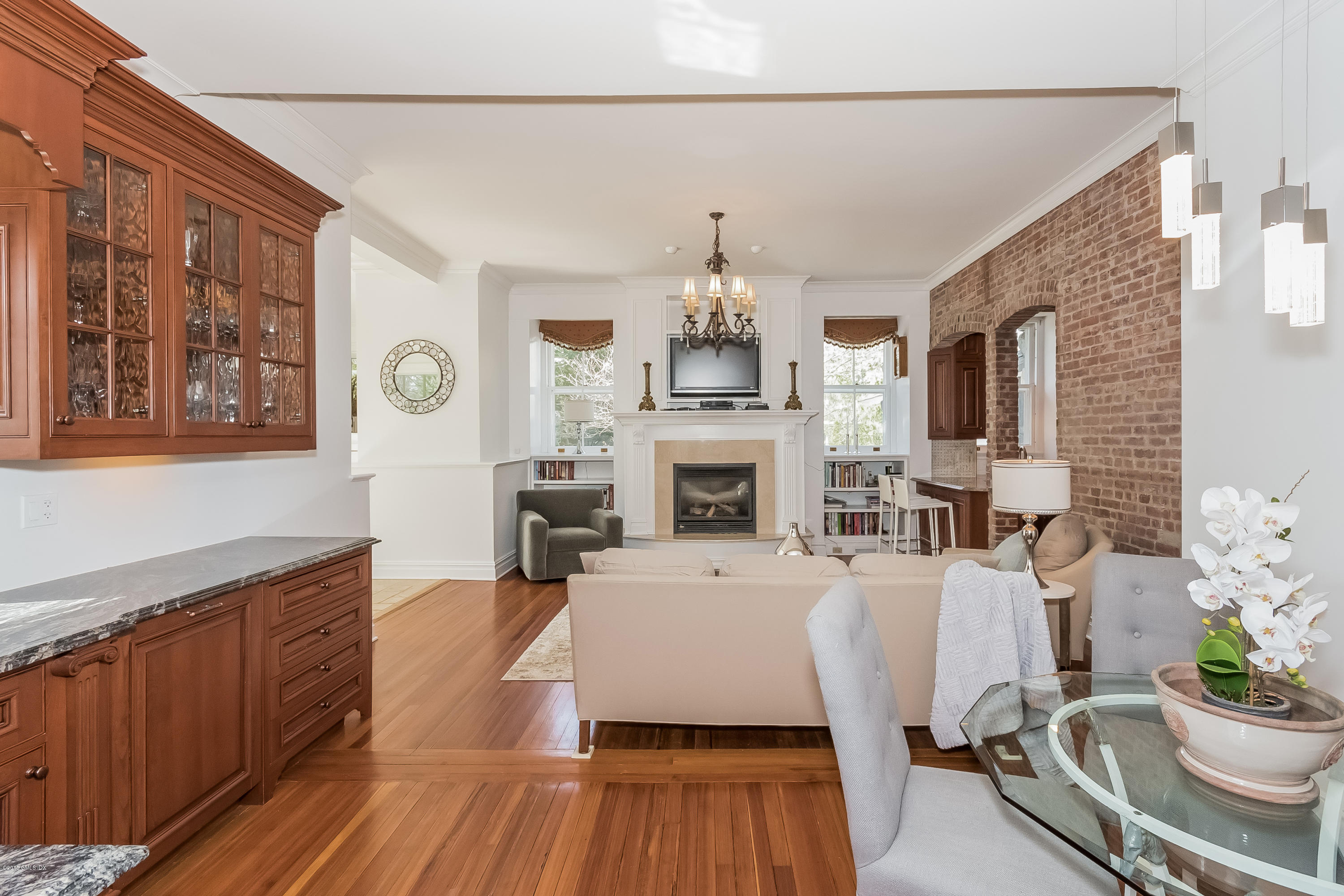 432 Field Point Road Greenwich, CT 06830 - Photo 13 of 25 a living room with furniture a fireplace and a large window