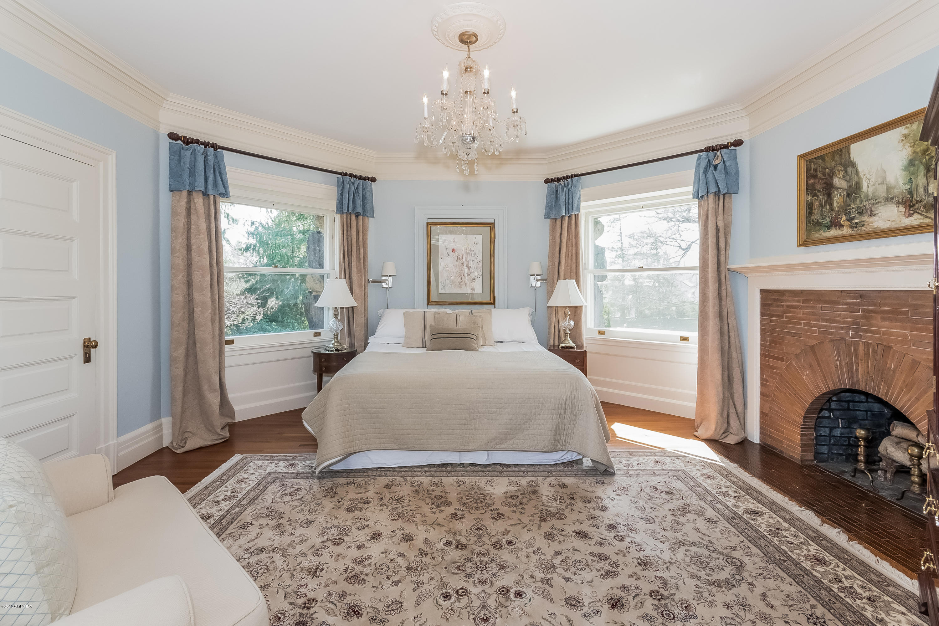 432 Field Point Road Greenwich, CT 06830 - Photo 16 of 25 a bedroom with a bed and a fireplace