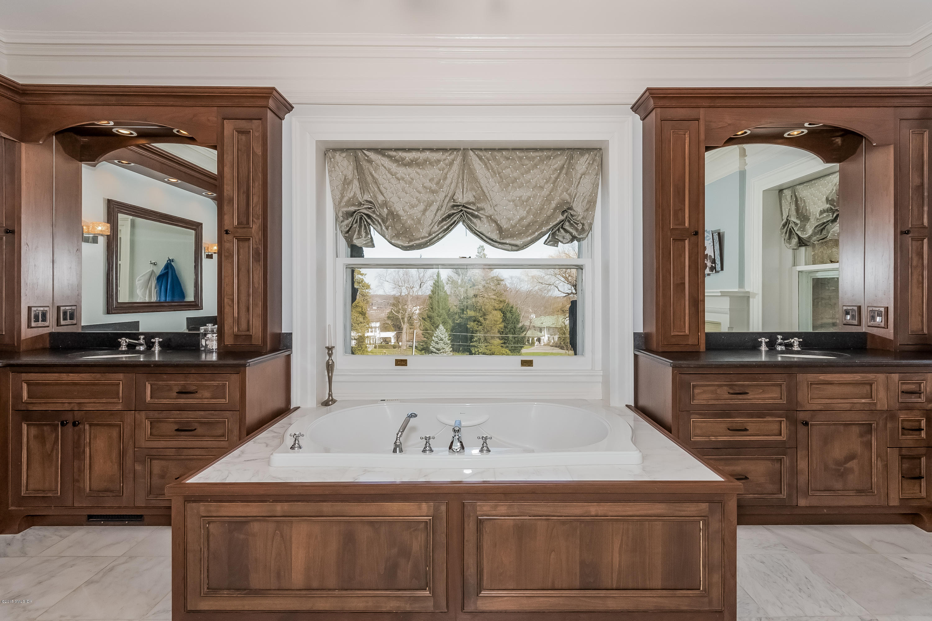 432 Field Point Road Greenwich, CT 06830 - Photo 17 of 25 a bathroom with a sink a vanity and a mirror