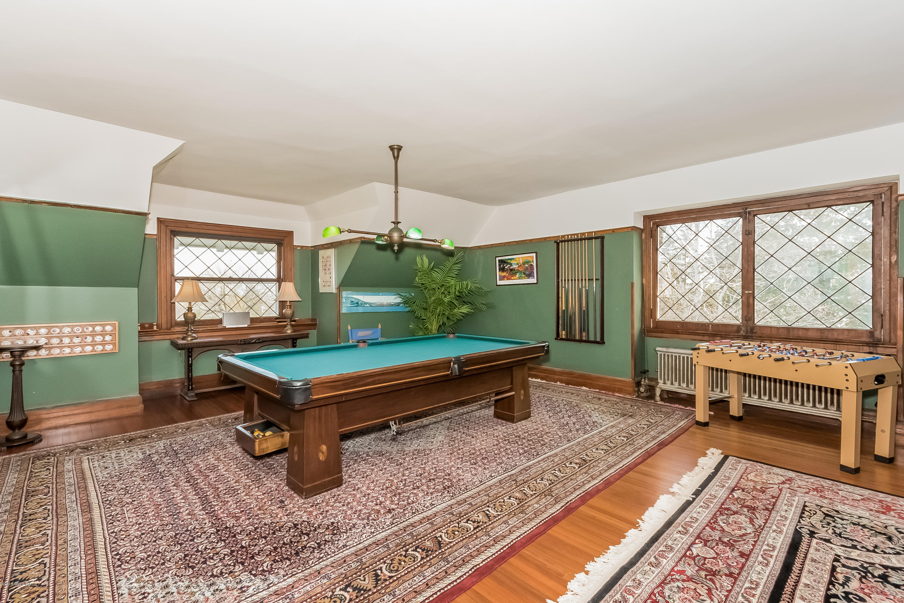 432 Field Point Road Greenwich, CT 06830 - Photo 21 of 25 a room with pool table and windows