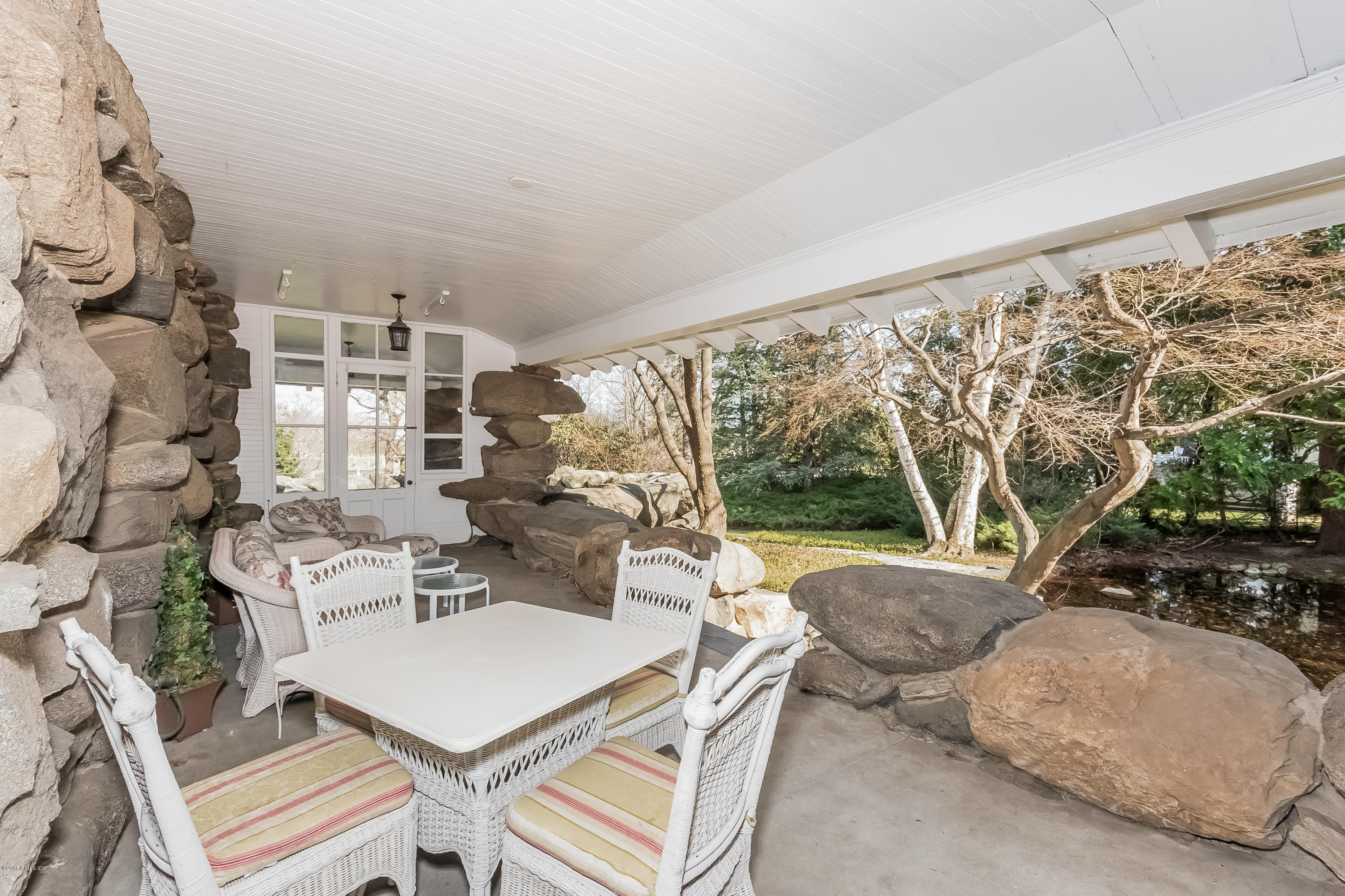 432 Field Point Road Greenwich, CT 06830 - Photo 24 of 25 a living room with furniture and a large window