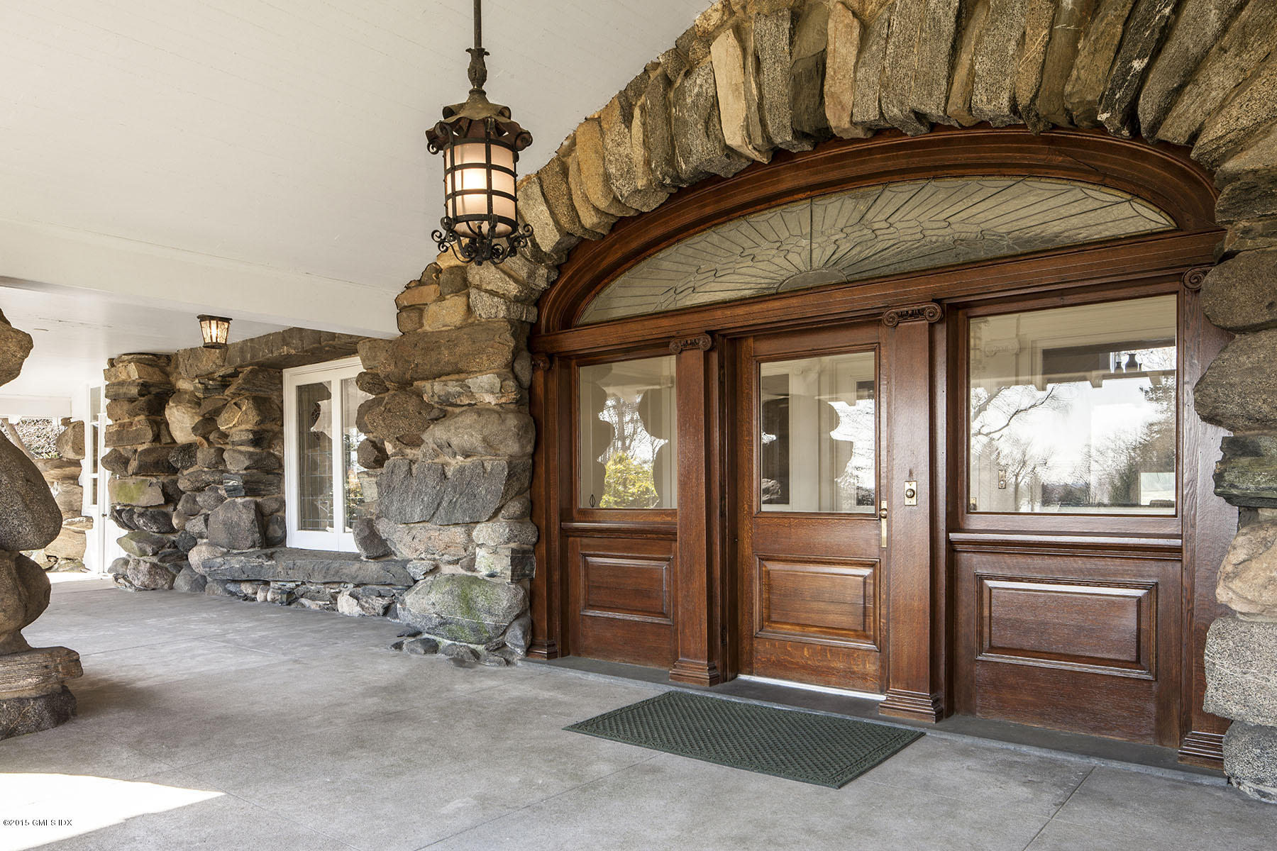432 Field Point Road Greenwich, CT 06830 - Photo 3 of 25 a view of a house with a door and windows