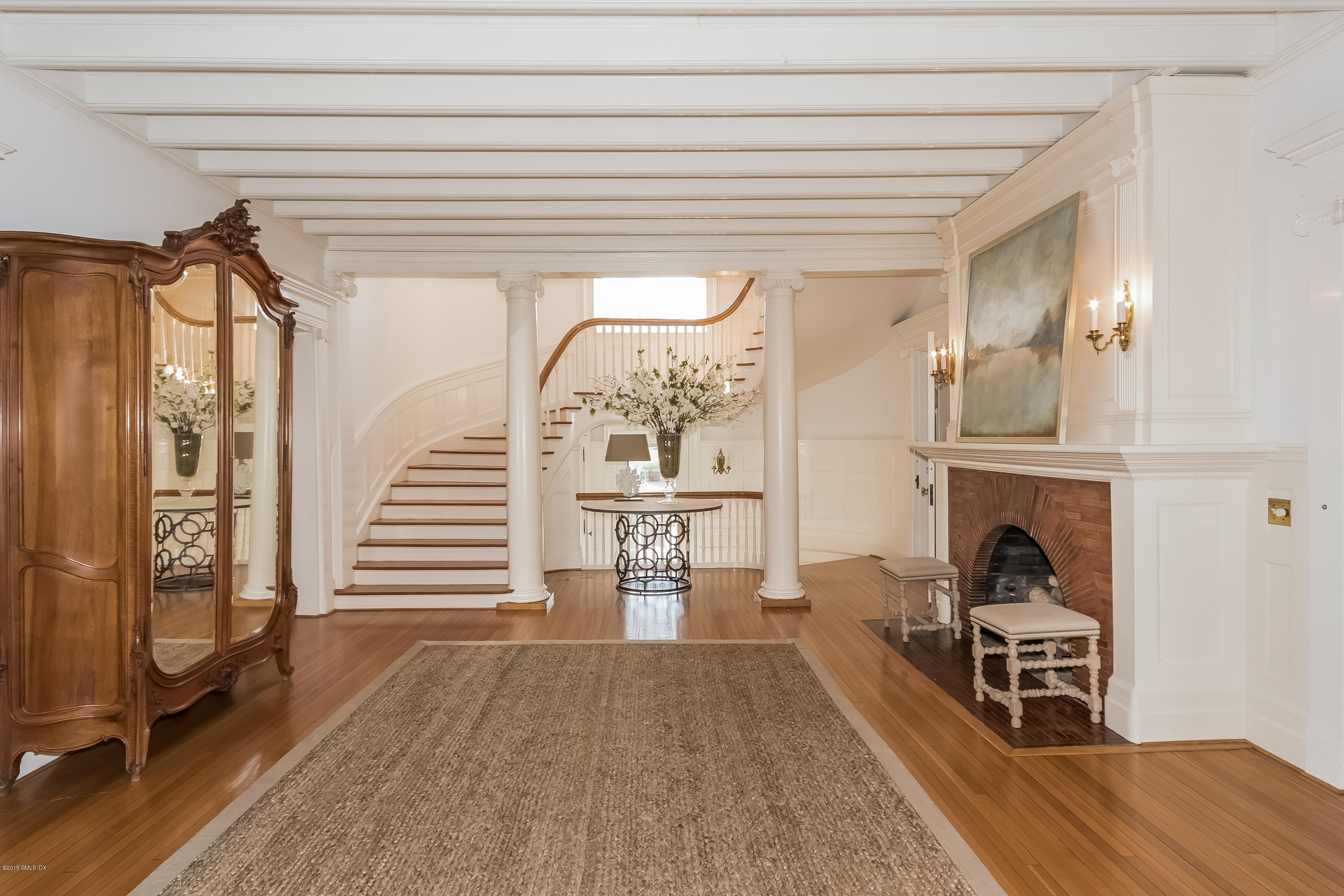 432 Field Point Road Greenwich, CT 06830 - Photo 4 of 25 a view of a livingroom with a fireplace and furniture