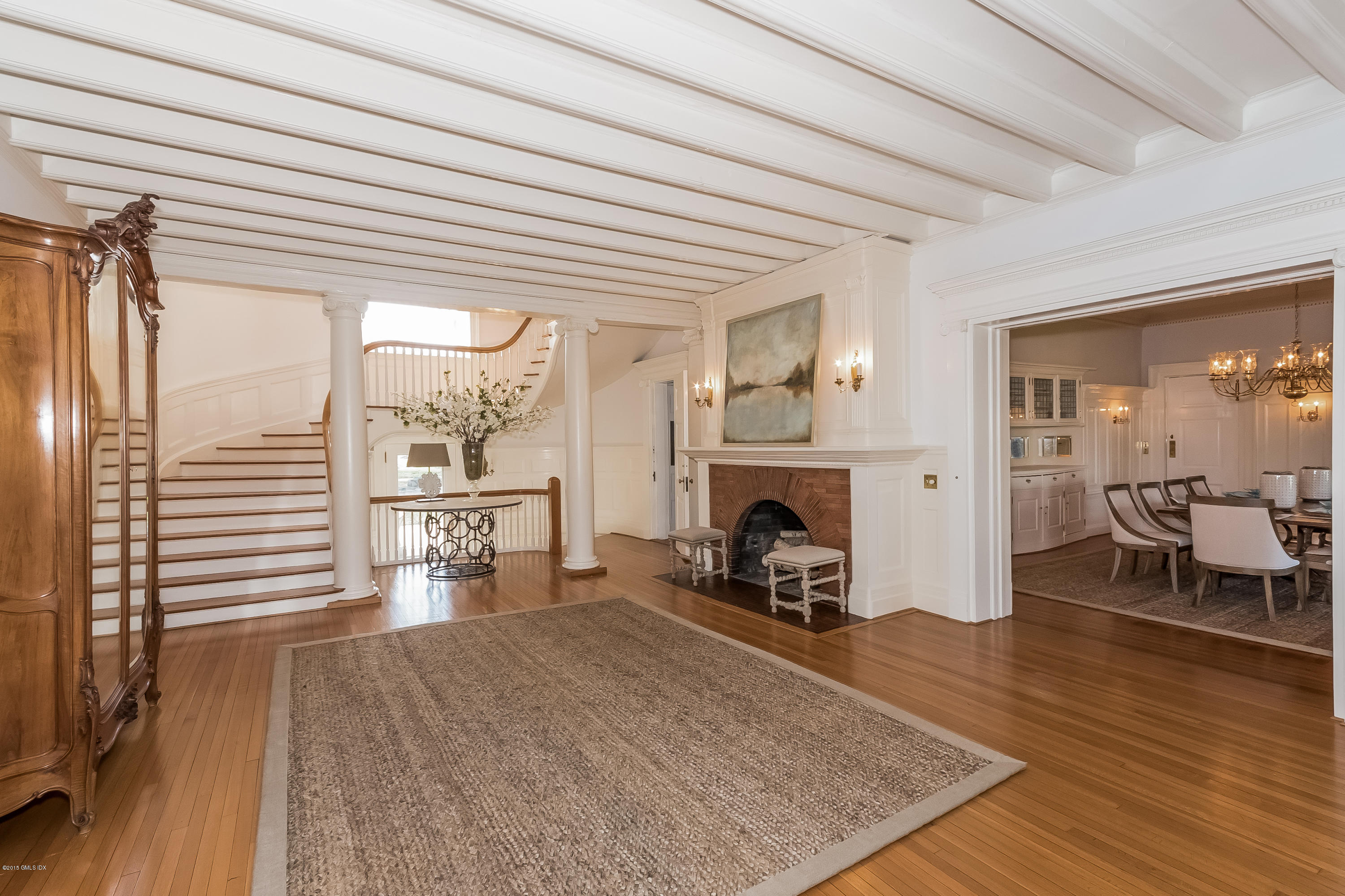 432 Field Point Road Greenwich, CT 06830 - Photo 5 of 25 a living room with furniture and a fireplace