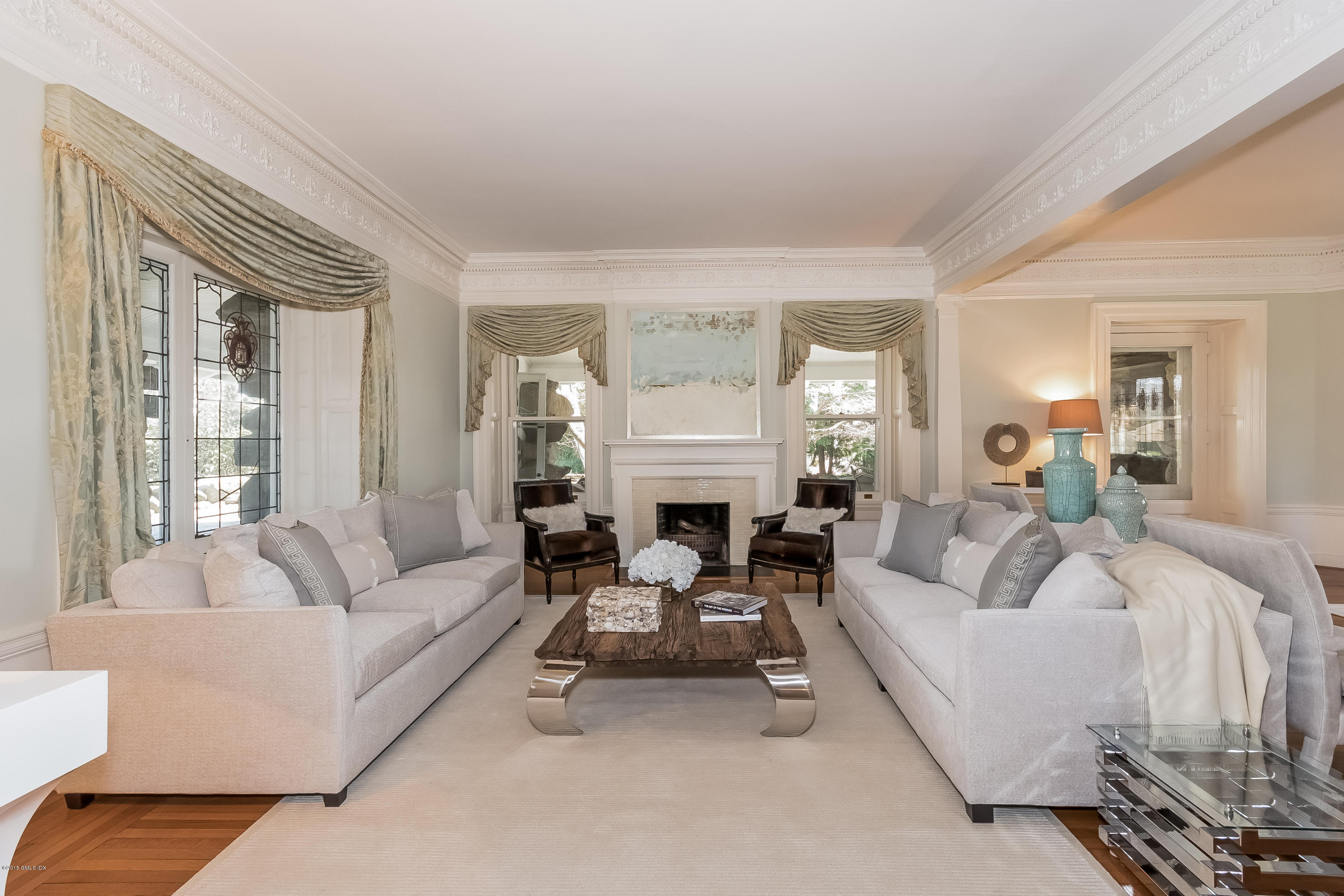 432 Field Point Road Greenwich, CT 06830 - Photo 7 of 25 a living room with furniture a large window and a fireplace