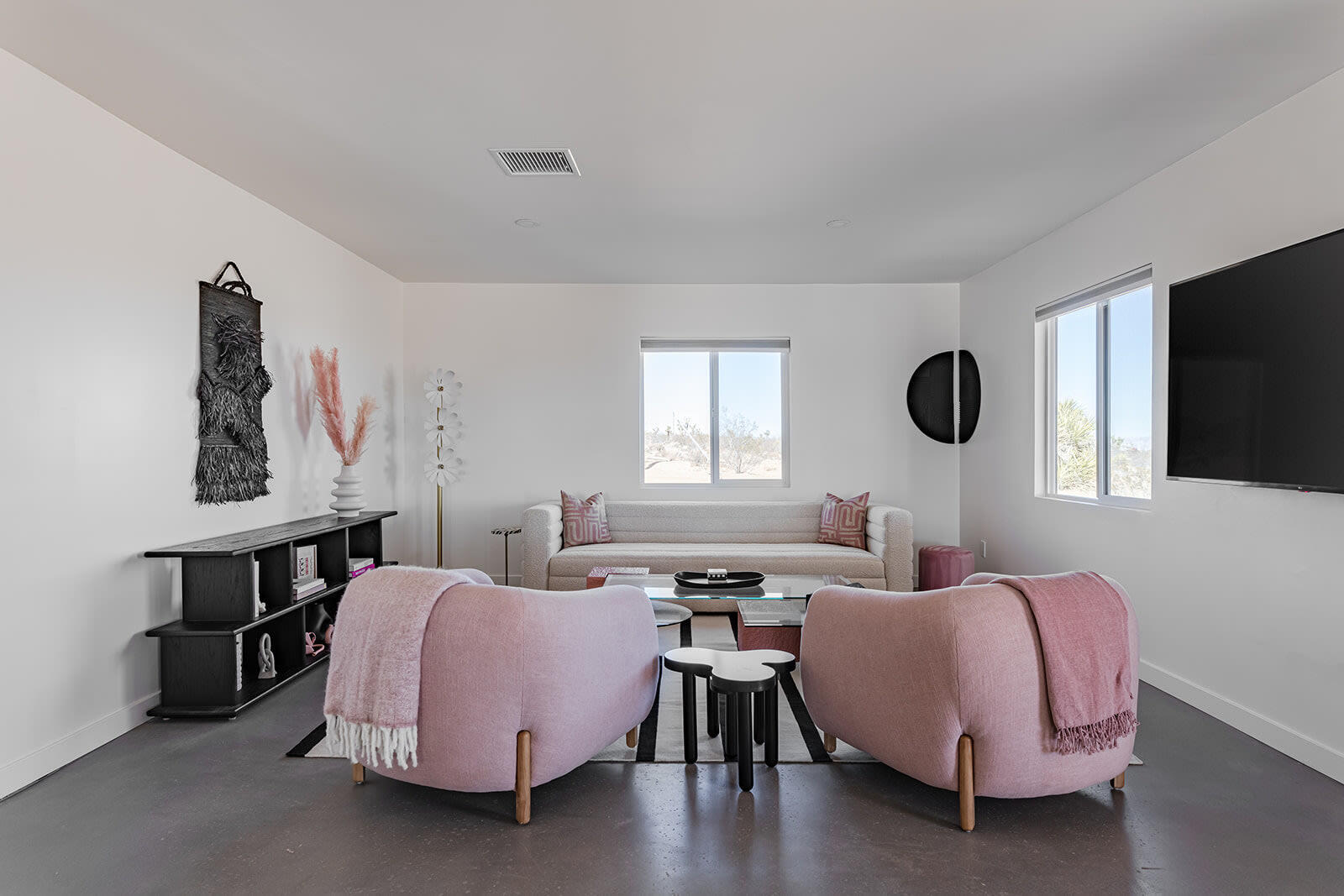 55717 Ruth Lane Yucca Valley, CA 92284 - Photo 21 of 32 a living room with furniture and a flat screen tv